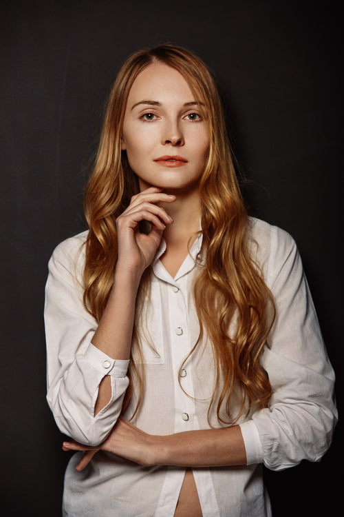 Womens white long sleeved button down shirt